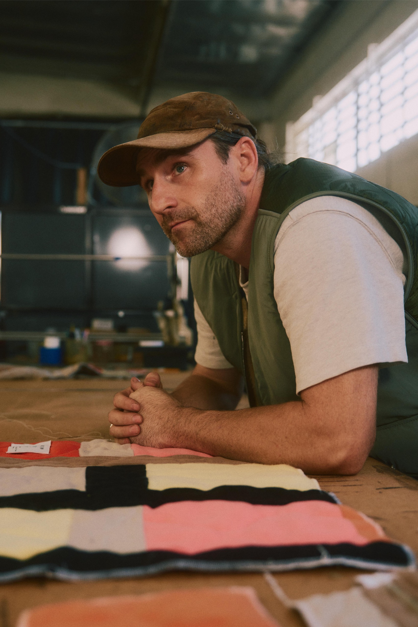 Stephen Kenn with upholstery samples in his workshop