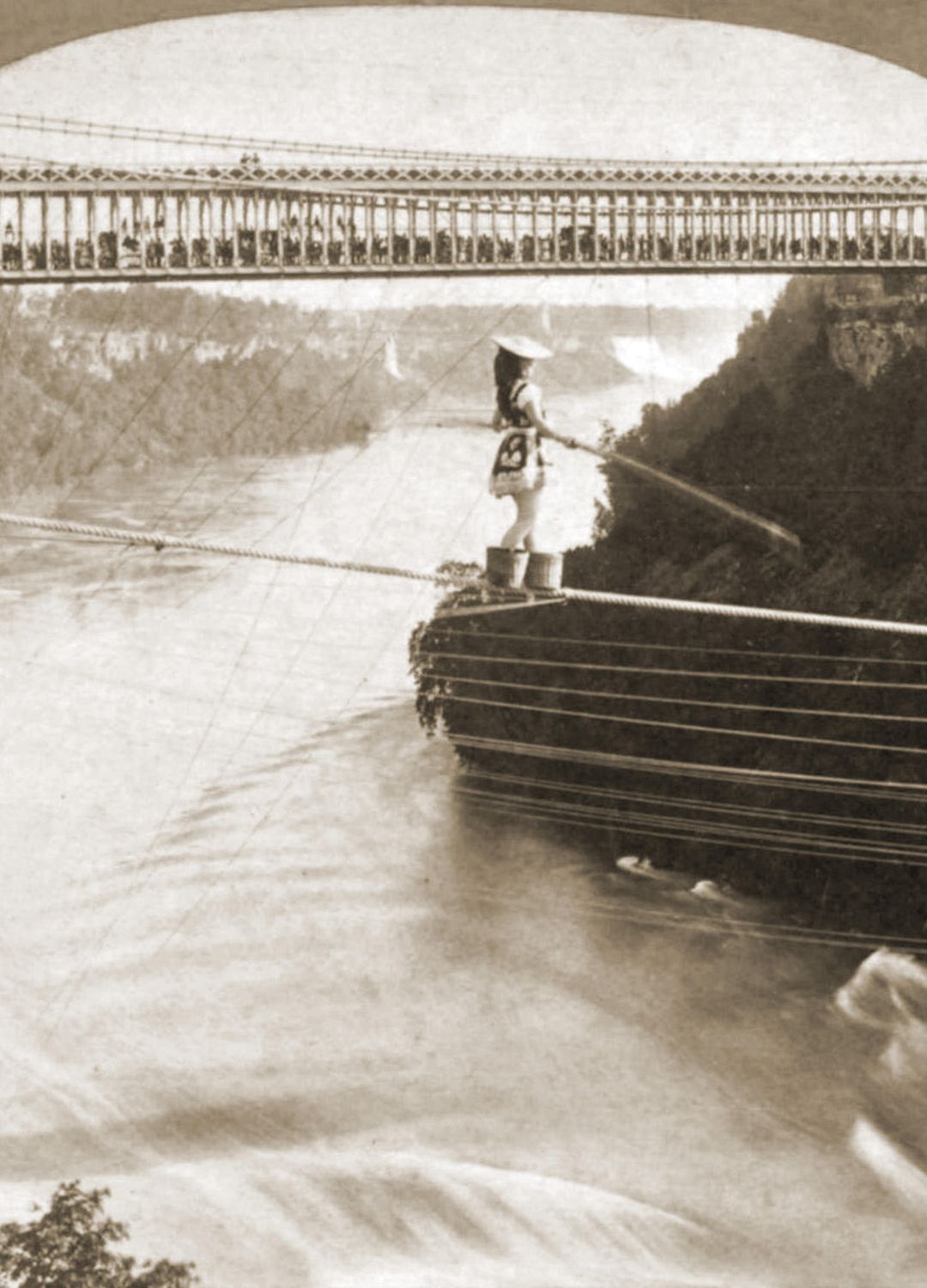 A sepia photograph of Maria Spelterini crossing Niagara Falls