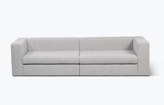 Grey minimalist sofa by Cini Boeri