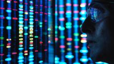 Somebody wearing sunglasses staring at bright lights to depict innovation