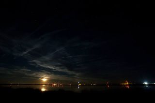 An Orbital Sciences Minotaur 1 rocket lights up the night sky as it launches the Air Force's ORS-3 mission of 29 small satellites into orbit from the Mid-Atlantic Regional Spaceport at NASA's Wallops Flight Facility on Wallops Island, Va., on Nov. 19, 201