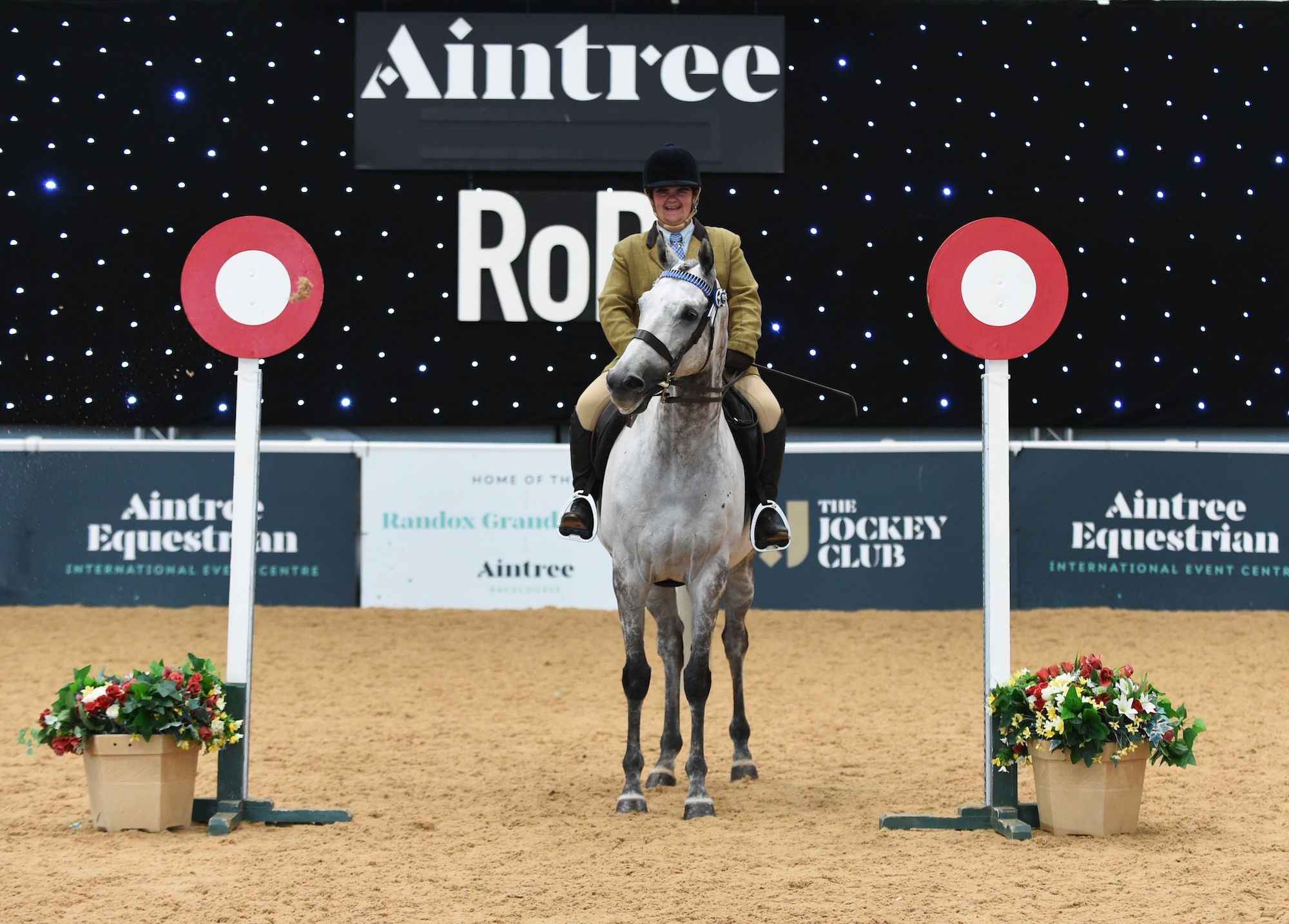 Danni Harris and Shadowfax in the winner's position at Aintree