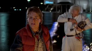 Michael J. Fox in the foreground looking stunned, with Christopher Lloyd in the background in Back to the Future. 