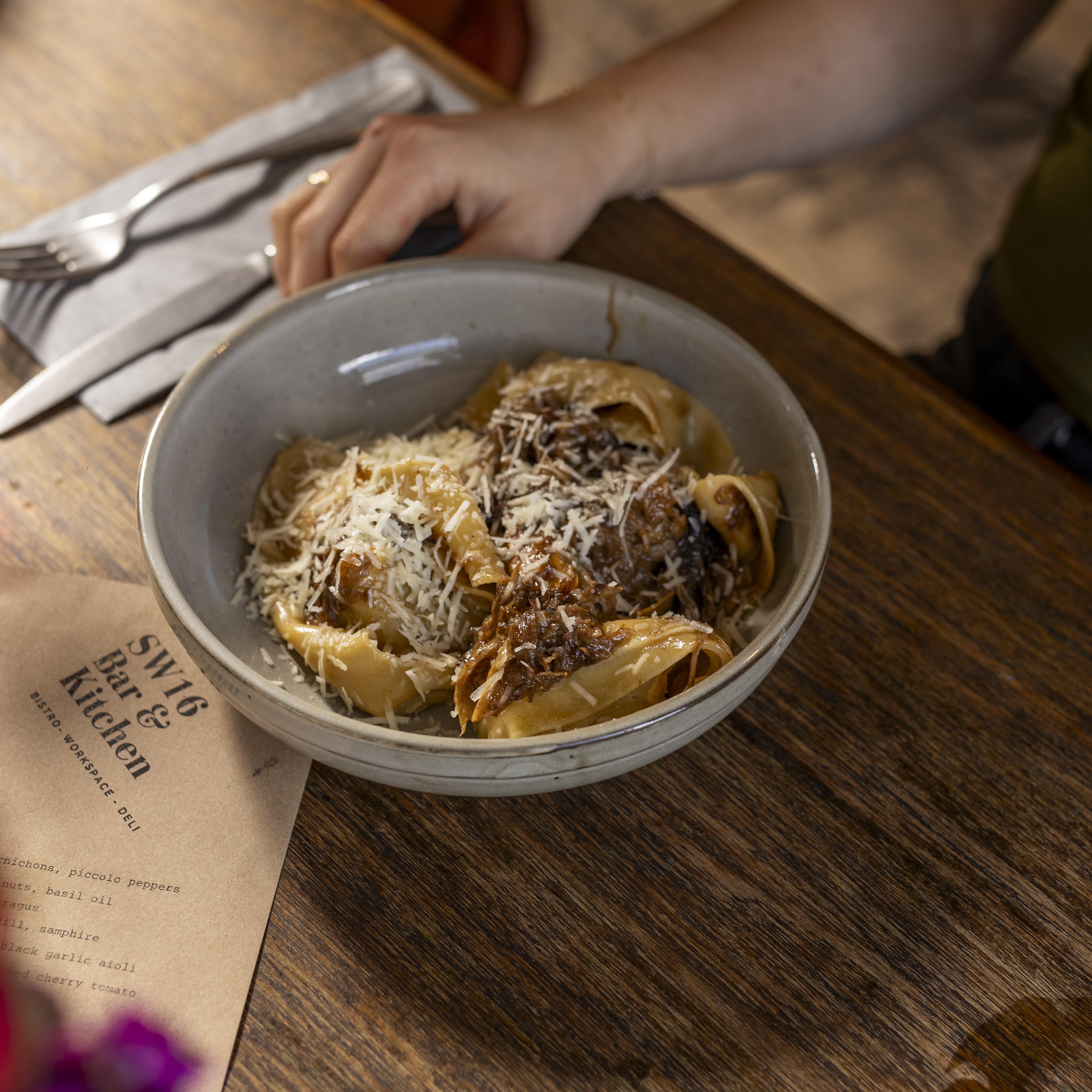 an image of a bowl of fresh handmade pasta on a brown rustic table at SW16