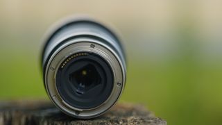 The Nikon mount version of the Tamron 18-300mm f/3.5-6.3 lens photographed outdoors