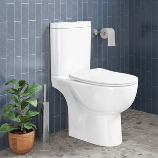 white toilet in grey tiled bathroom