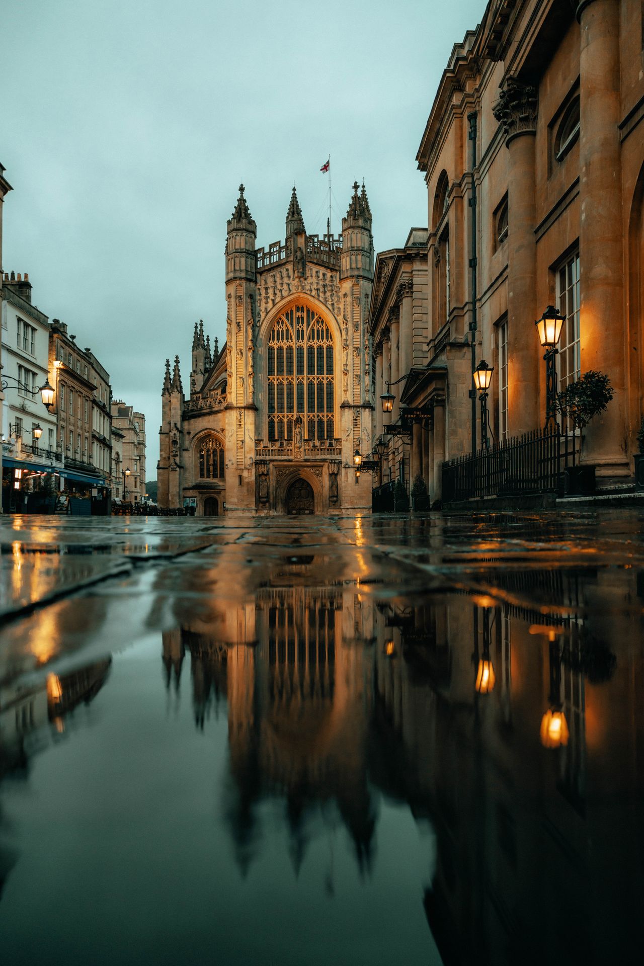 Reflections in puddles at Bath Abbey, UK