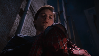 Peter looking at suit in alleyway in Spider-Man 2