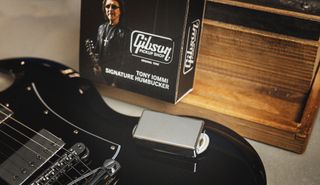 A Gibson Tony Iommi Humbucker sits atop a black Gibson SG guitar