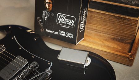 A Gibson Tony Iommi Humbucker sits atop a black Gibson SG guitar