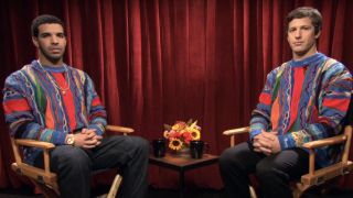 Drake and Andy Samberg wearing matching sweaters in the SNL Digital Short "Drake Interview"