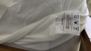 The care instruction label of the Brooklyn Bedding Cooling Mattress Protector