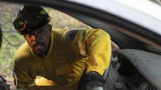 Jason Winston George as Ben in a yellow uniform in Station 19 season 7 