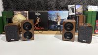 Ruark MR1 Mk3 and Cambridge L/R S speakers side-by-side on white table