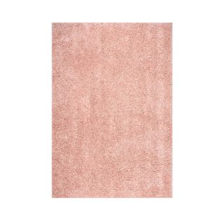 A peach colored shag rug