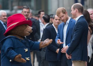 Prince William and Prince Harry meeting a life-sized Paddington bear