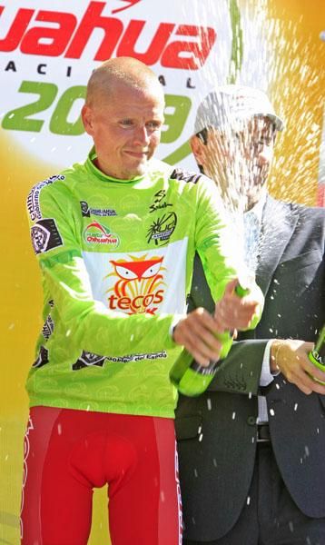 Rasmussen gets funky with the bubbly as he celebrates the overall lead.