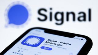 Signal logo on the AppStore displayed on a phone screen and Signal logo in the background are seen in this illustration photo taken in Poland on January 14, 2021. 