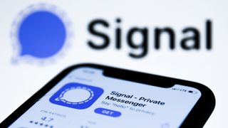 Signal logo on the AppStore displayed on a phone screen and Signal logo in the background are seen in this illustration photo taken in Poland on January 14, 2021.