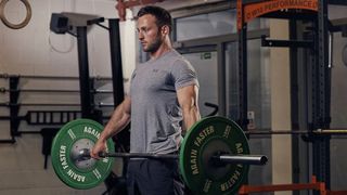 Man demonstrates midway position of snatch-grip deadlift