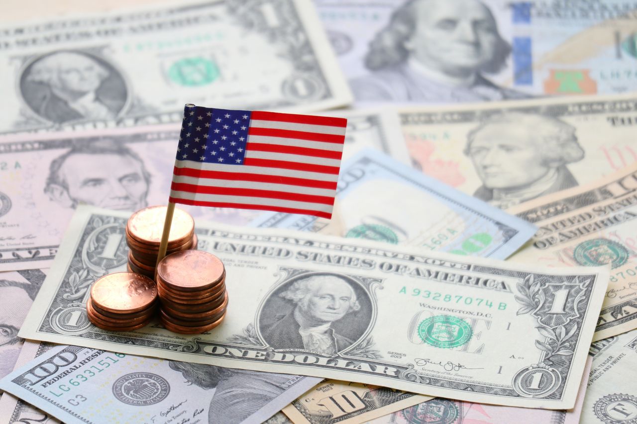 US flag and Dollar cash background, finance and economy concept