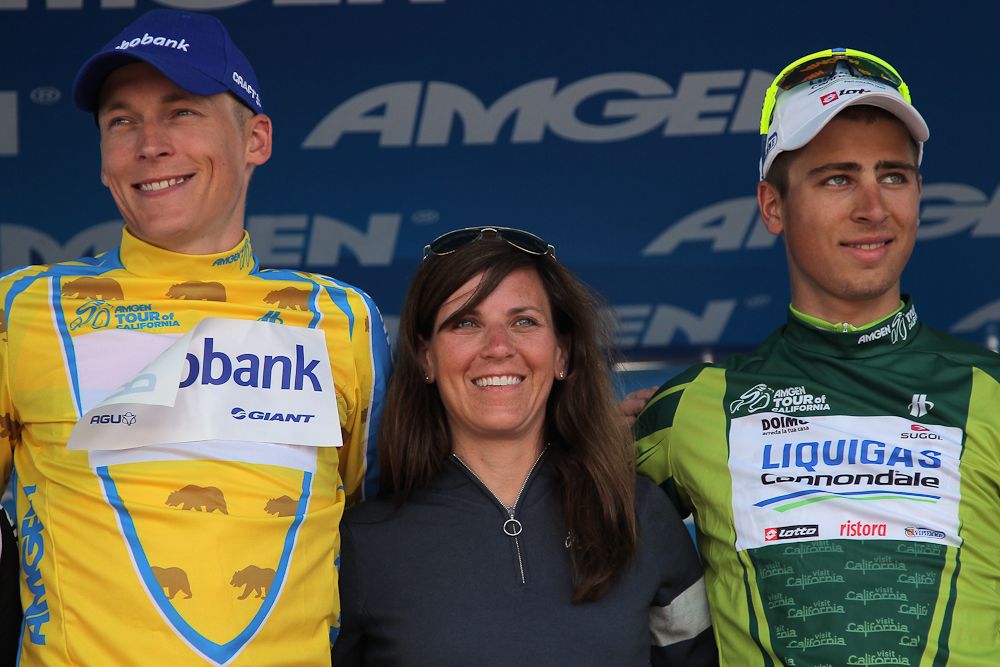 Kristin Bachochin (C), Executive Director and Senior Vice President of AEG Sports, poses on the poduim with Robert Gesink (L) of The Netherlands riding for Rabobank Cycling Team in the overall race leader jersey and Peter Sagan (R) of Slovkia riding for Liquigas-Cannondale.