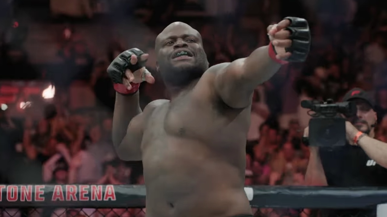 Derrick Lewis pretending to draw a bow and fire an arrow.