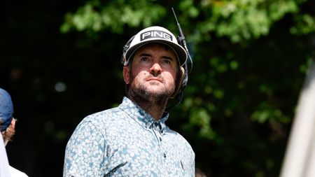 Bubba Watson looks on while performing broadcast duties during the 2022 LIV Golf season