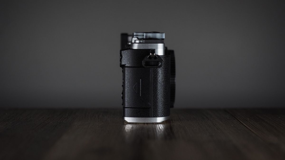 OM System OM-3 on a wooden surface