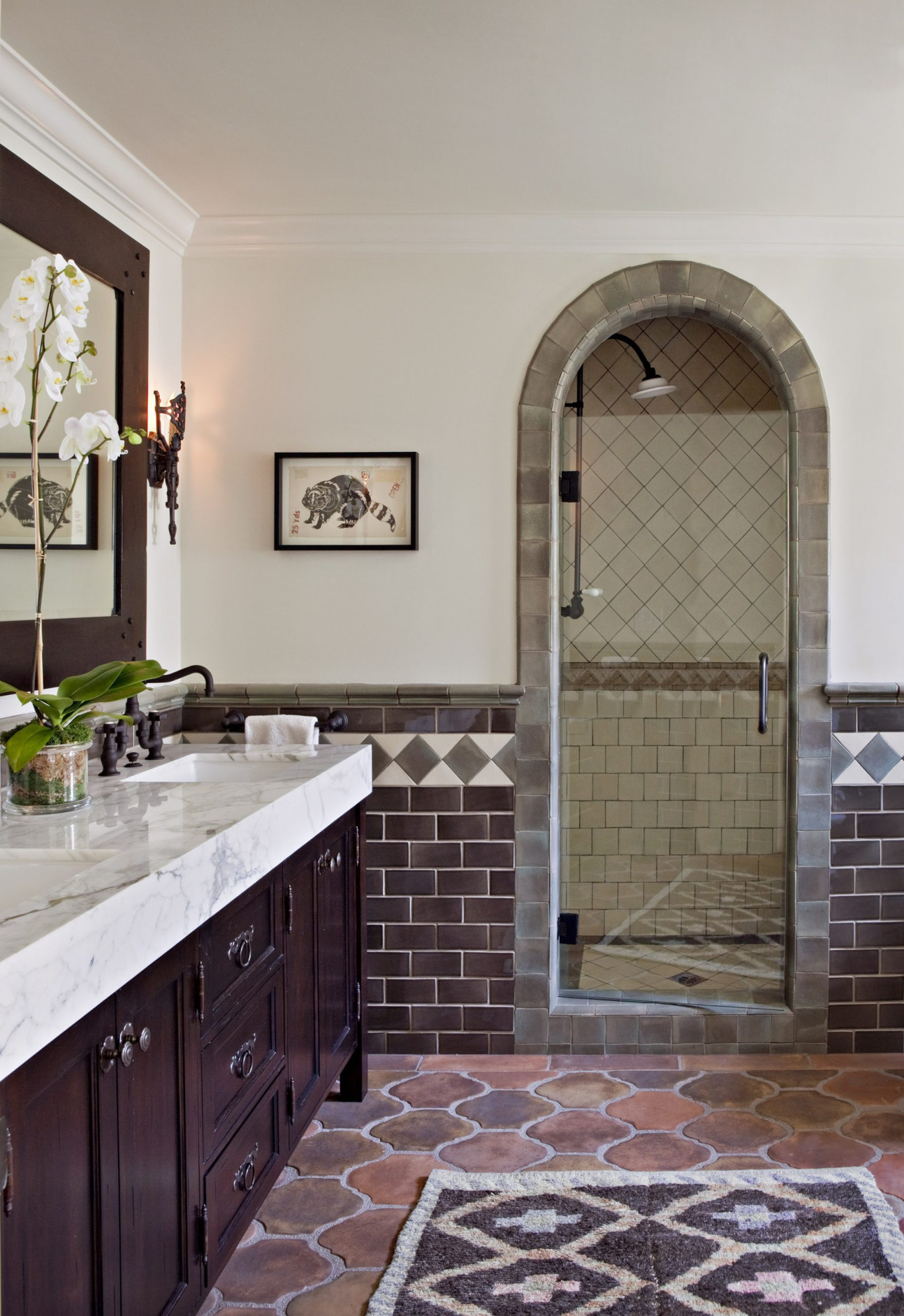 Bathroom with terracotta floor tiles, purple wall tiles and border