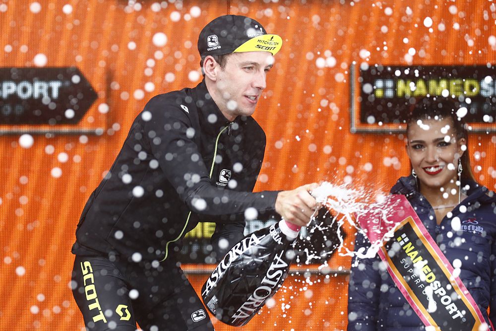 Simon Yates celebrates his third stage win on the podium , stage 15 at the Giro d'Italia