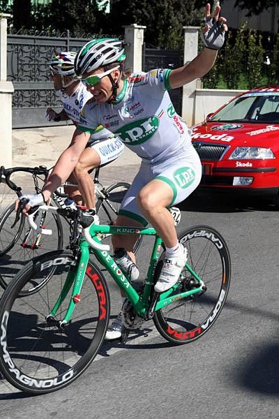 Di Luca signals to his team car.