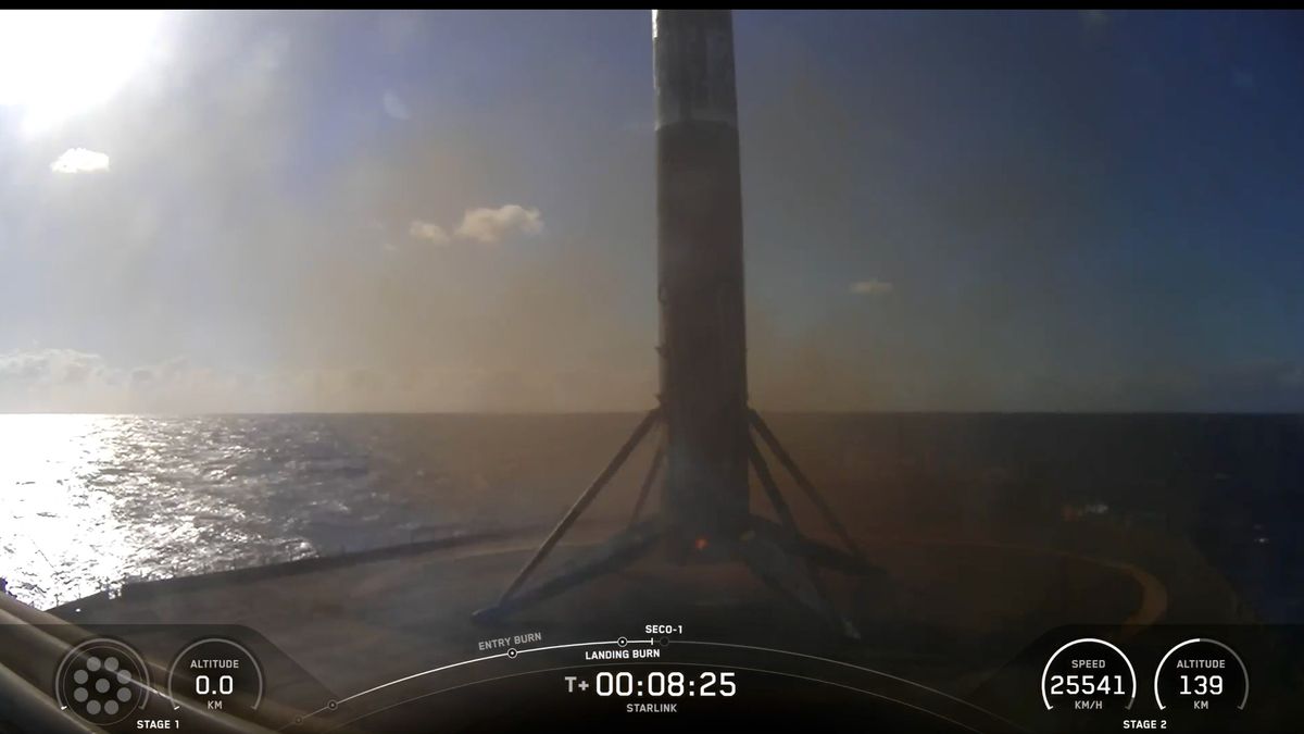 a black and white rocket rest on the deck of a ship at sea