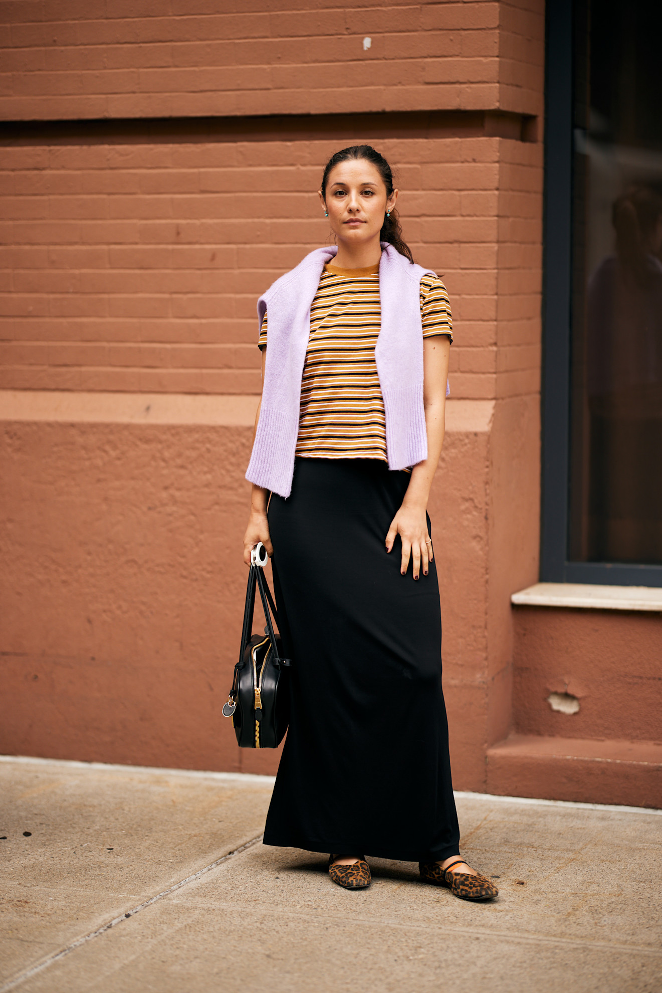 fashion week attendee wearing fall shoe trends to spring summer 2026 fashion week