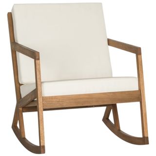 Teak colored rocking chair with low profile and cream back and seat cushions