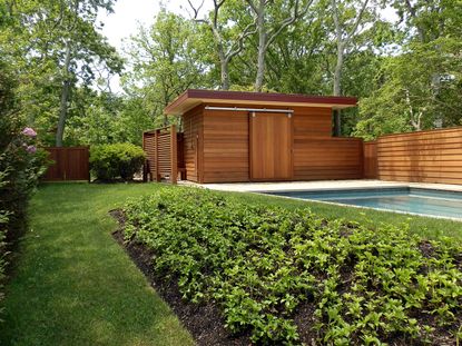 summerhouse ideas with sleek modern wood cladding and a pool