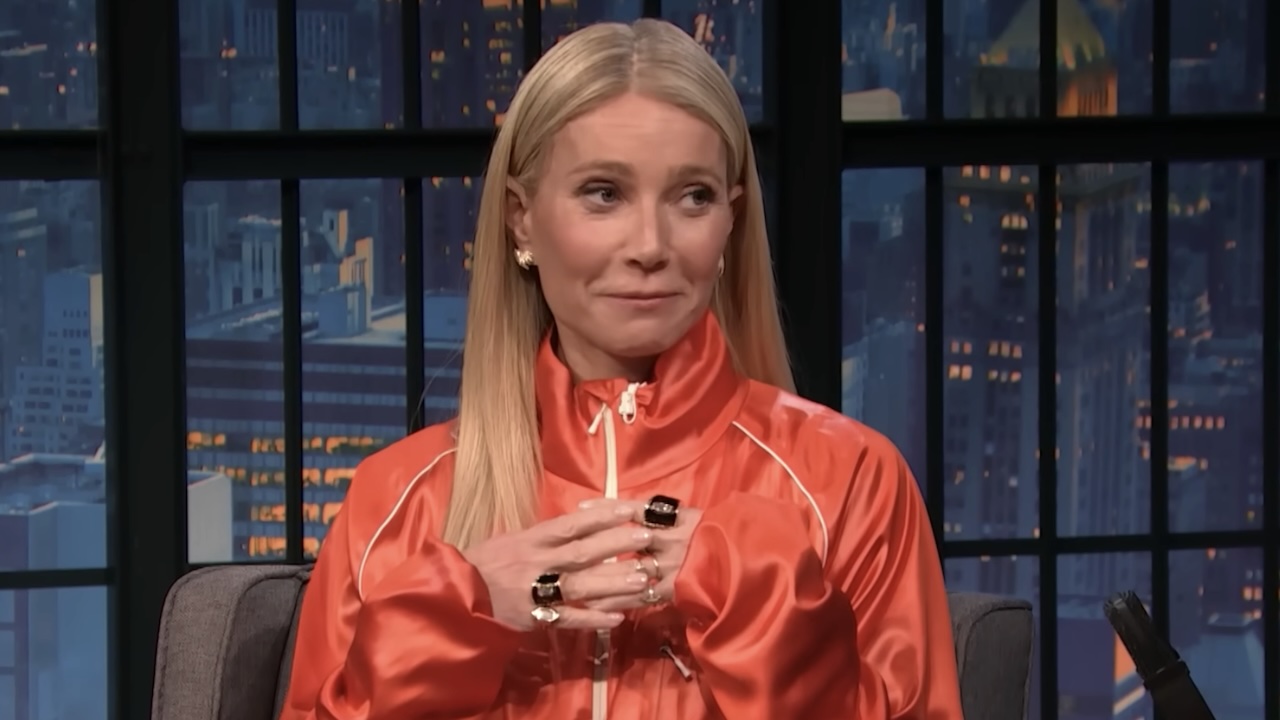 Gwyneth Paltrow with hands clasped on Late Night with Seth Myers