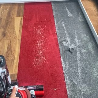 Image of Hoover being used on carpet