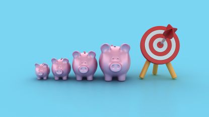 Four piggy banks lined up next to a target with an arrow in the bull's-eye.