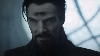 Benedict Cumberbatch smiles evilly with a third eye showing in Doctor Strange in the Multiverse of Madness.