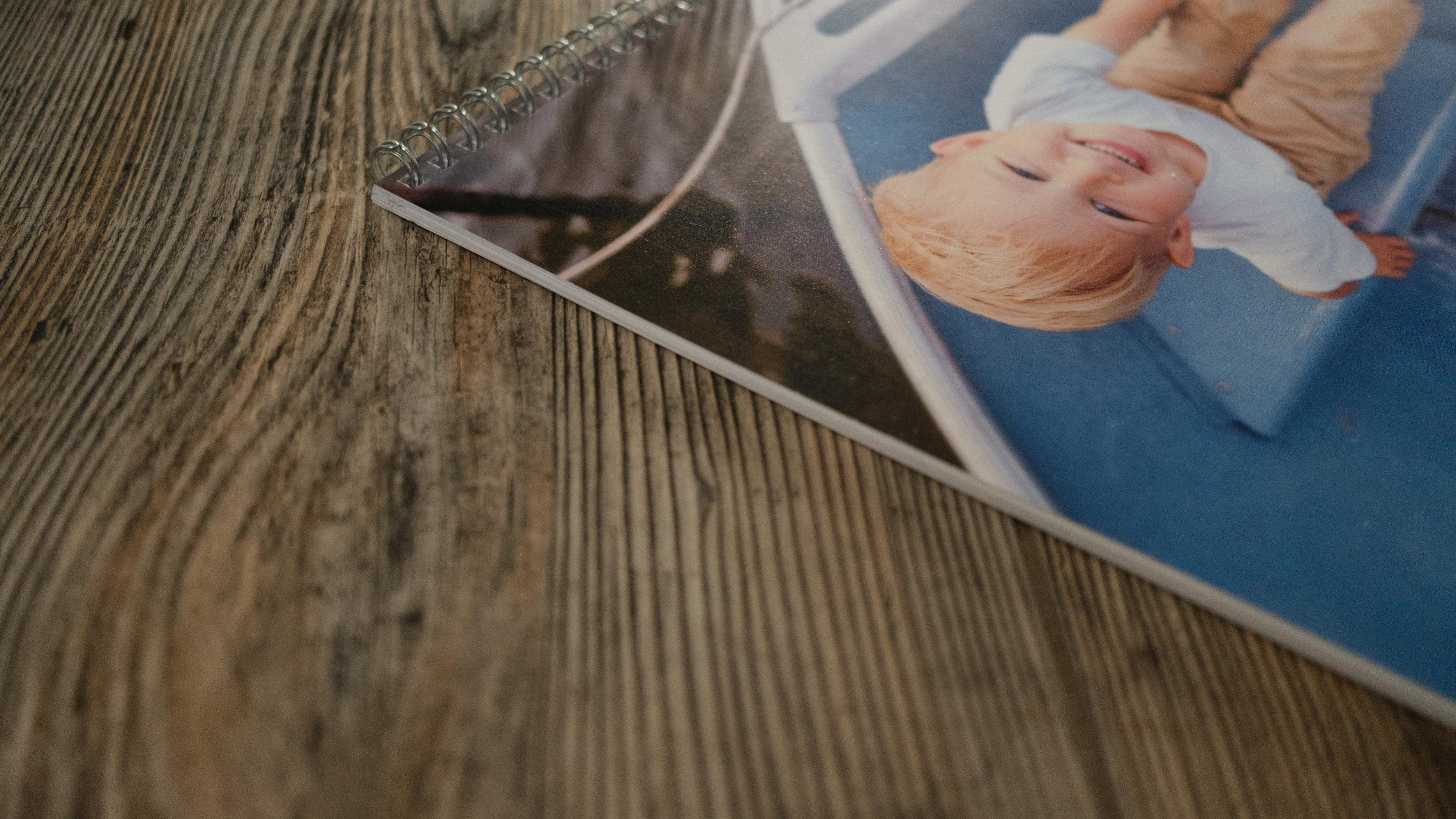 A photo calendar from Shutterfly on a wood background