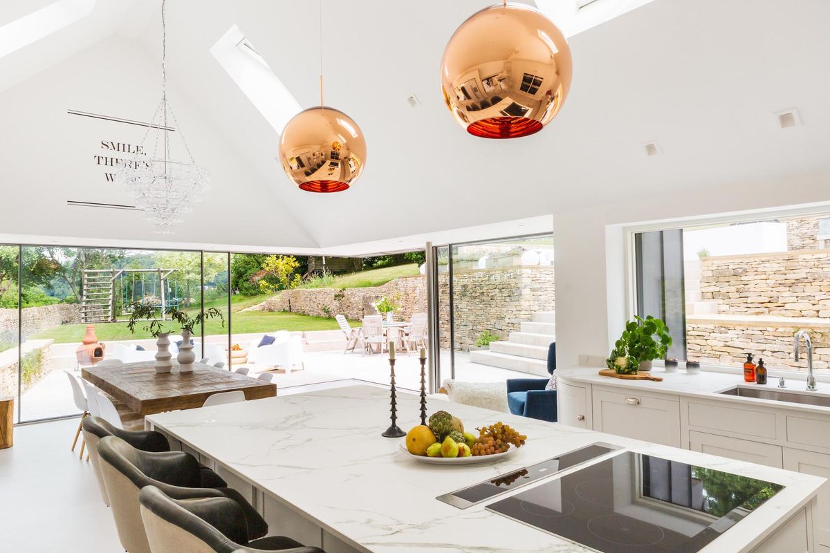 white kitchen extension with vaulted ceiling