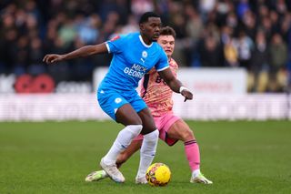 Ephron Mason-Clark of Peterborough United and Jamie Shackleton of Leeds United battle for the ball during the Emirates FA Cup Third Round match between Peterborough United and Leeds United at Weston Homes Stadium on January 07, 2024 in Peterborough, England. (Photo by Marc Atkins/Getty Images)