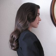 Creator Ilirida Krasniqi wearing a chic long haircut.