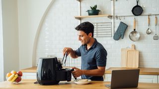 Man cooking with an air fryer