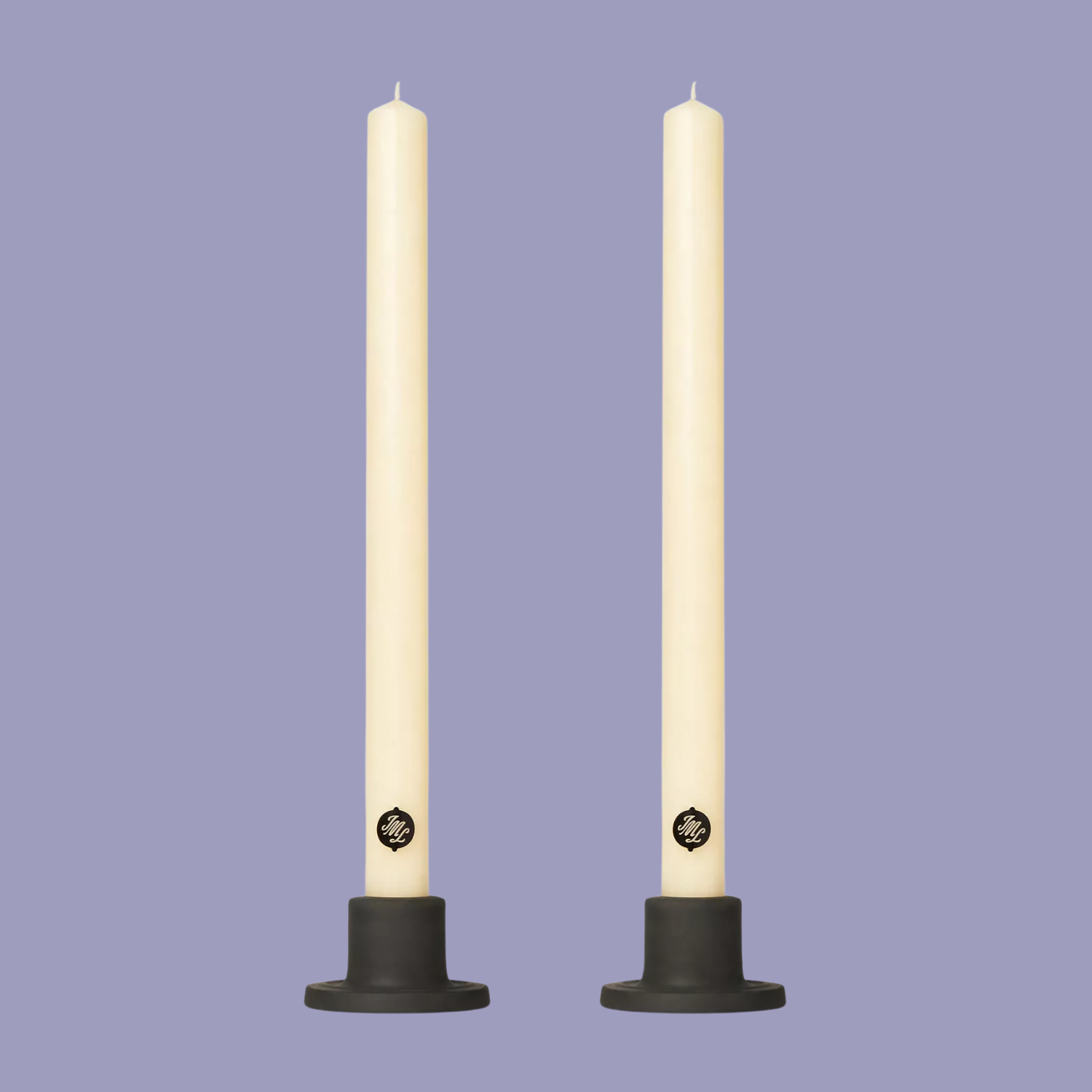 A pair of scented dinner candles