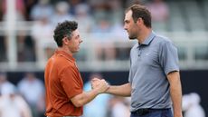 Rory McIlroy and Scottie Scheffler shake hands on the green at the PGA Championship
