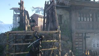 Naoe clings onto some bamboo scaffolding as a guard approaches in Hijiyama Fort in Assassin's Creed Shadows