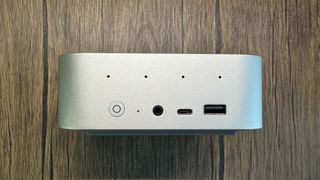 Beelink SER9 Mini PC on a wood background