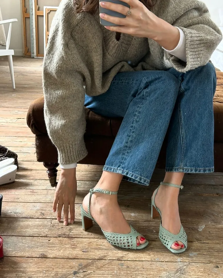 Woman in jeans and woven shoes